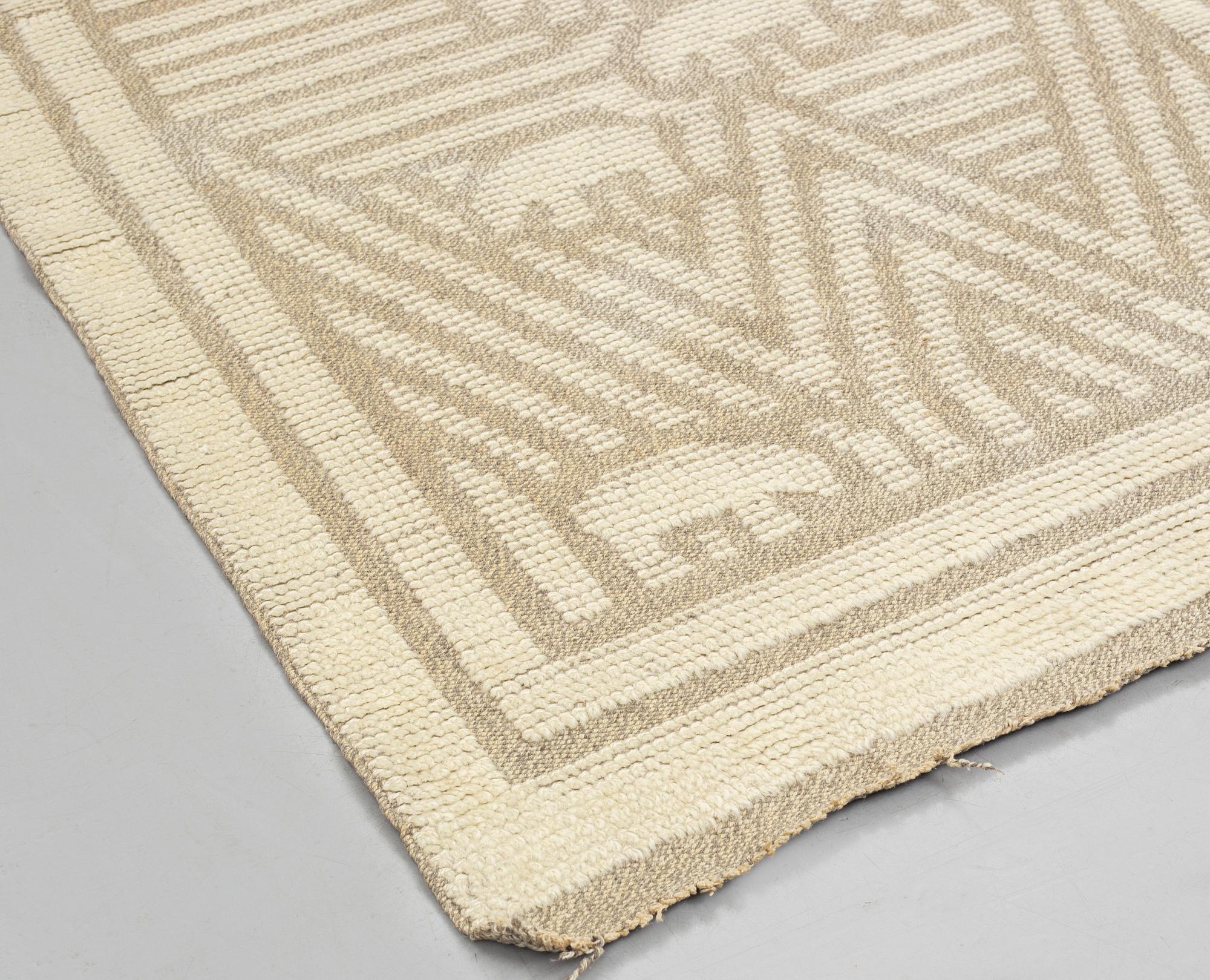 matto, knotted pile in relief, ca 187,5-189,5 x 96,5-100 cm, signed and dated S.K.L.H. 1945 at the back.