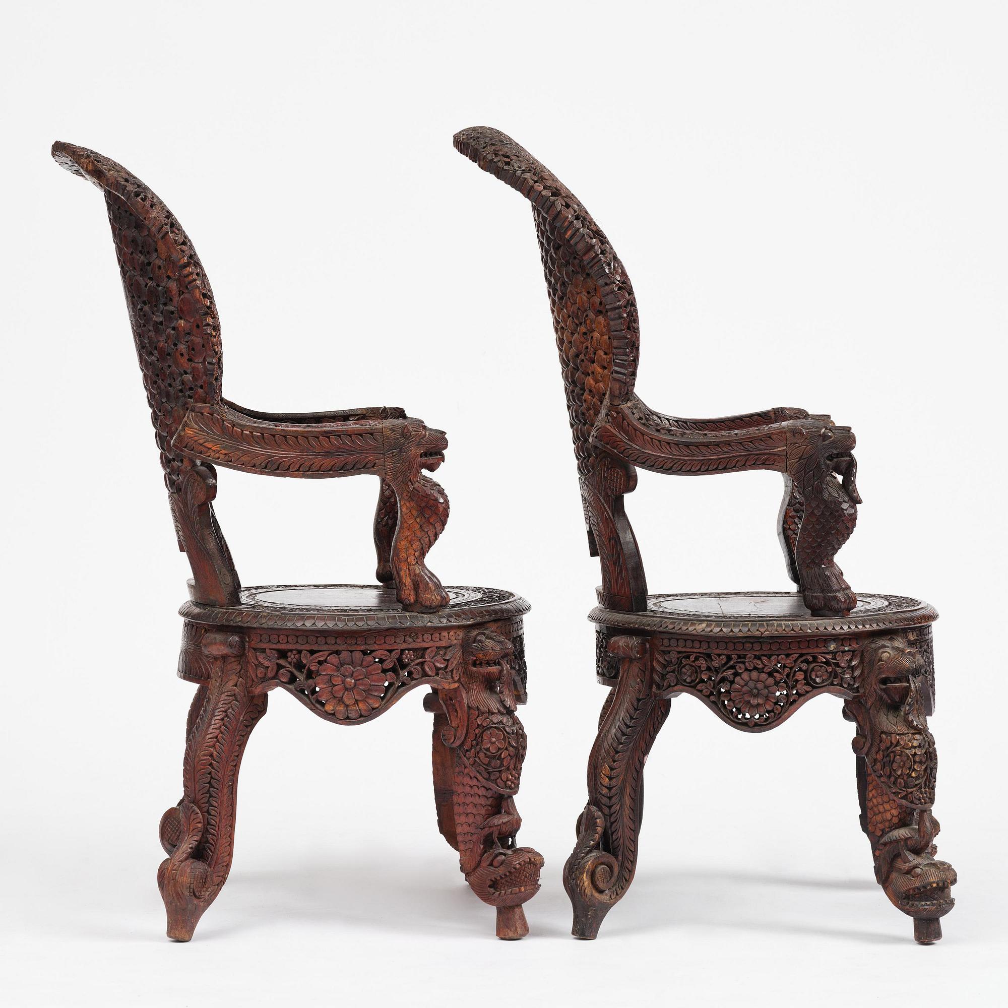 A pair of carved 'blackwood' armchairs, Bombay presidency, British Raj, circa 1880.