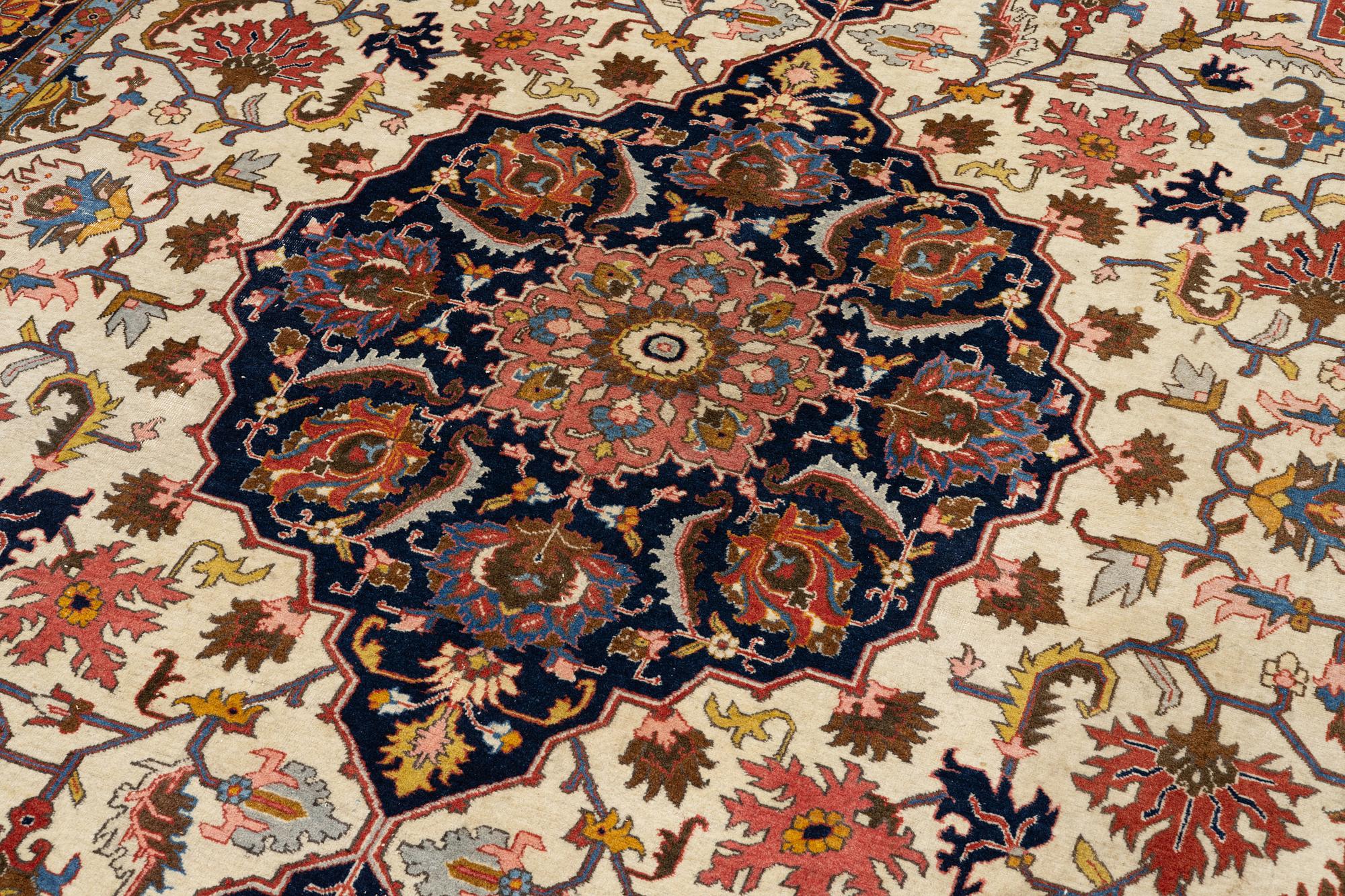 An antique Tabriz carpet, c. 365 x 280 cm.
