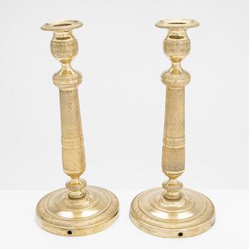 A pair of early 19th century French gilded Empire candlesticks.