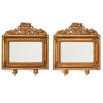 93. A pair of Swedish Empire two-light girandole mirrors, first half of the 19th century.