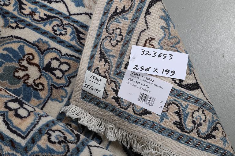 A carpet, Nain, part silk, ca 256 x 199 cm.