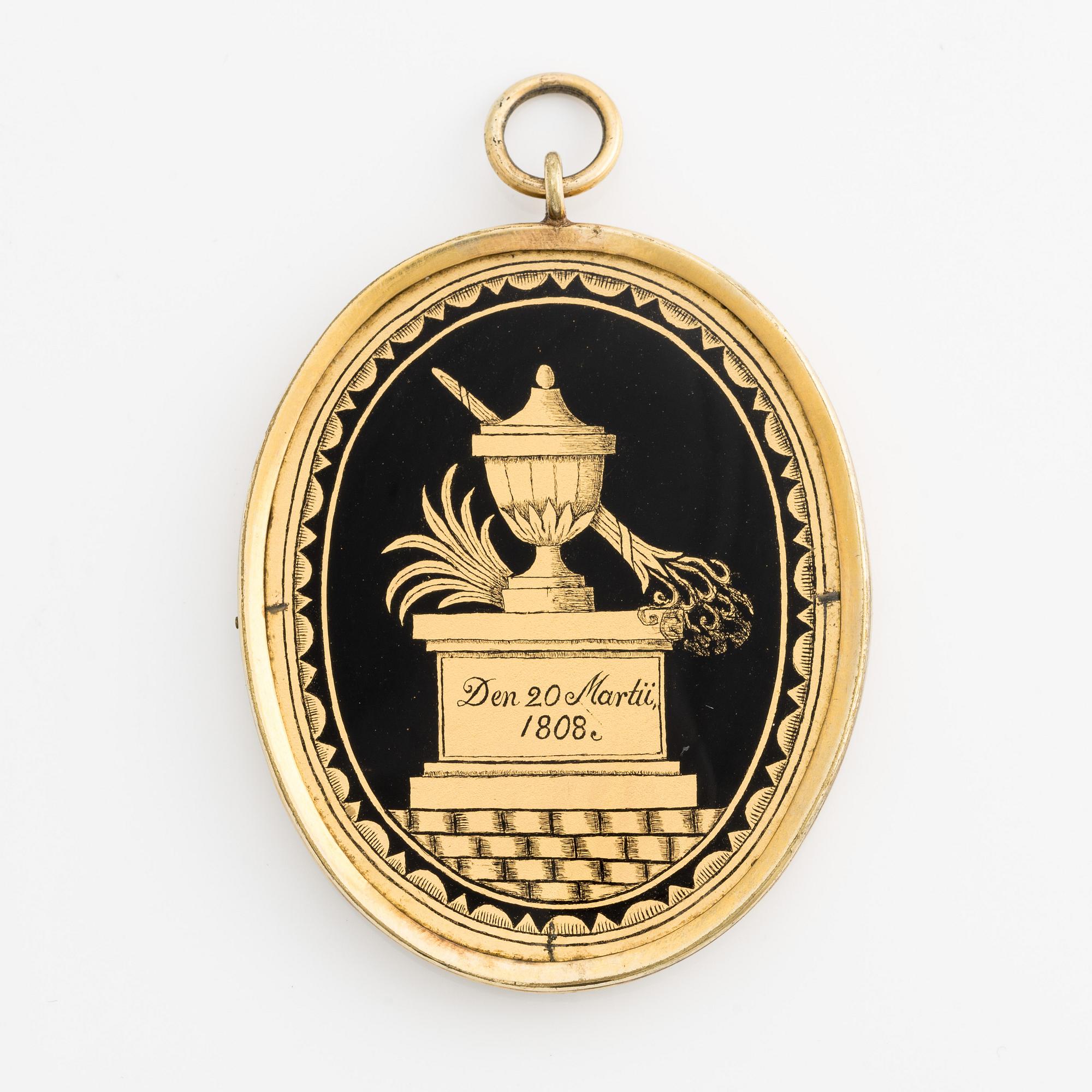 Pendant/memorial medallion with silhouette.
