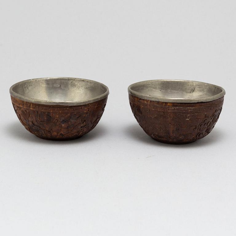 A pair of wooden bowls with pewter inlays, Qing dynasty, late 19th/early 20th century.