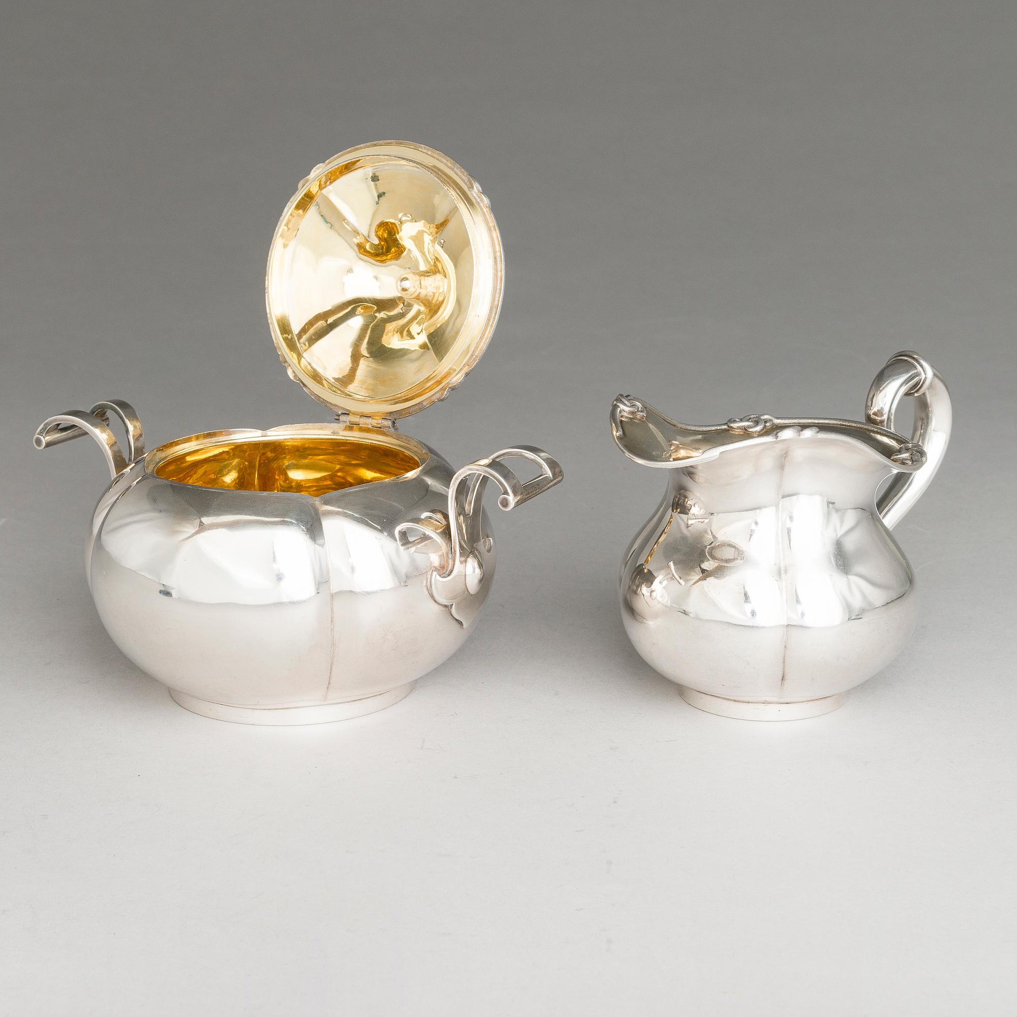 SAZIKOV, A 5-piece silver coffee and tea set, mark of the Sazikov Firm, Imperial Warrant, Saint Petersburg 1860.