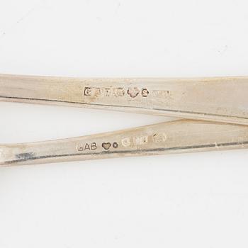 Guldsmedsaktiebolaget (GAB), 13 bordsskedar, 12 teskedar, silver, Stockholm 1943-1975.