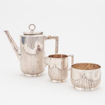 A Swedish silver coffee pot, creamer and sugar bowl, Stockholm 1908.