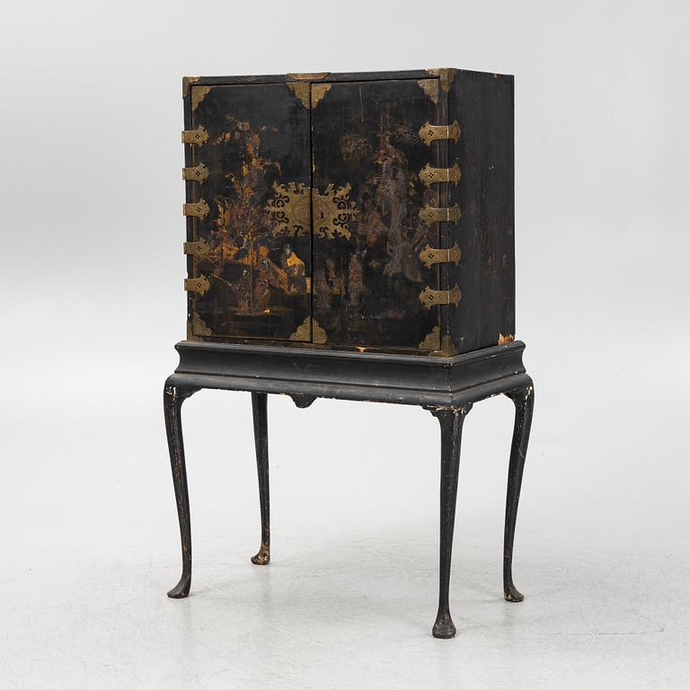 A Cabinet, on a stand, 19th century.