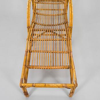 A mid-20th century rattan lounge chair.