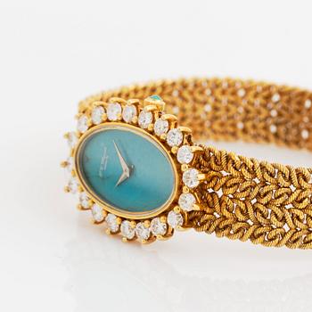 A Chopard for Kutchinsky 18K gold watch with a turquoise dial and a diamond bezel.