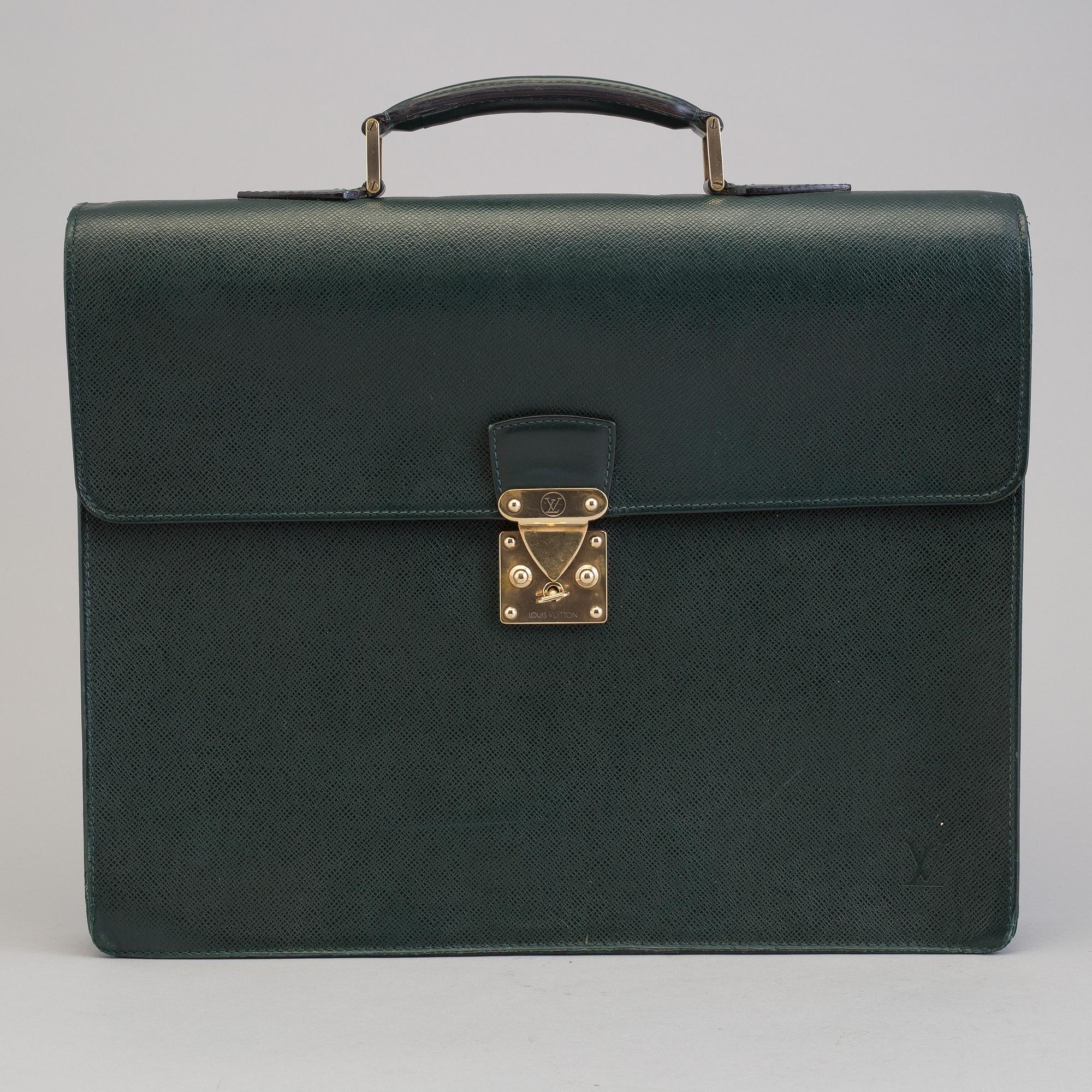 A Louis Vuitton green taiga Ambassador Briefcase.