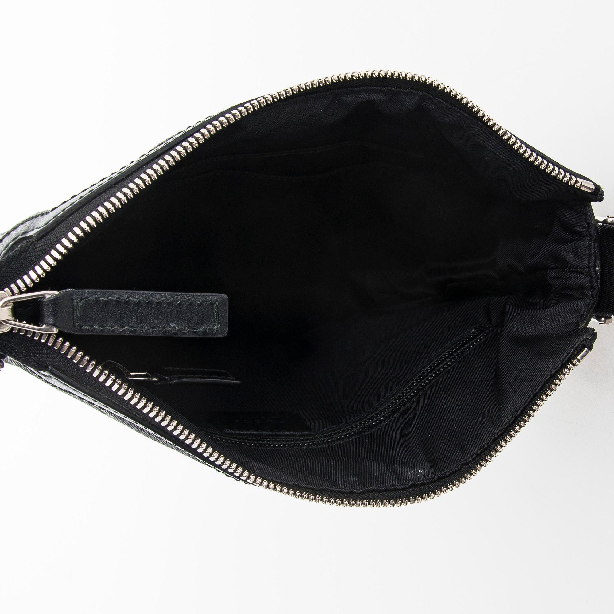 Gucci, a "Techno Canvas Web Messenger" bag.