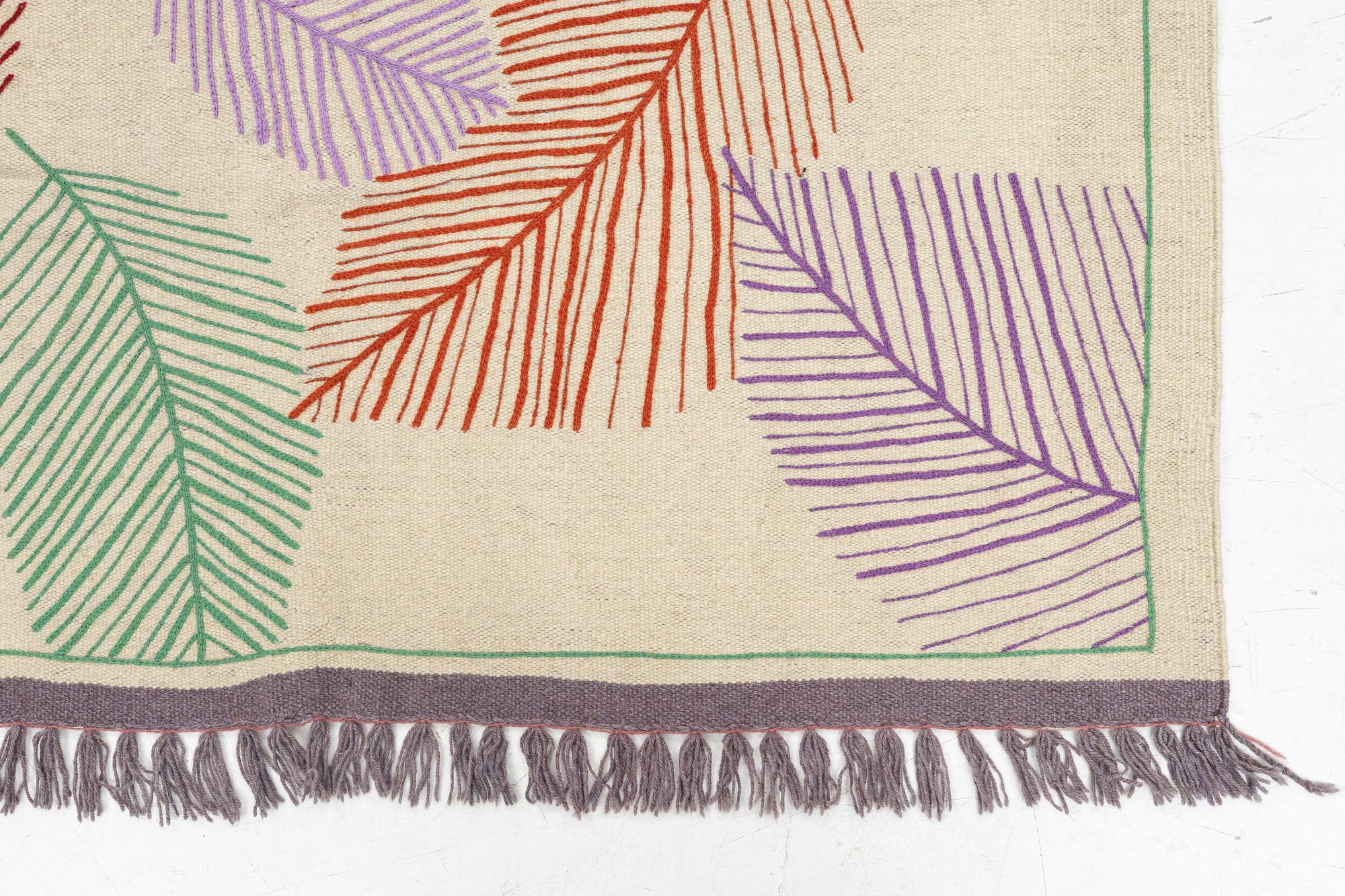 A hand-embroidered Kilim rug, c. 199 x 145 cm.