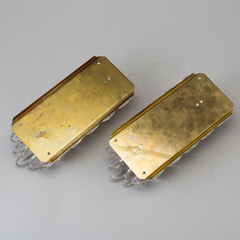 CARL FAGERLUND, a pair of glass wall lights, Orrefors, late 20th century.