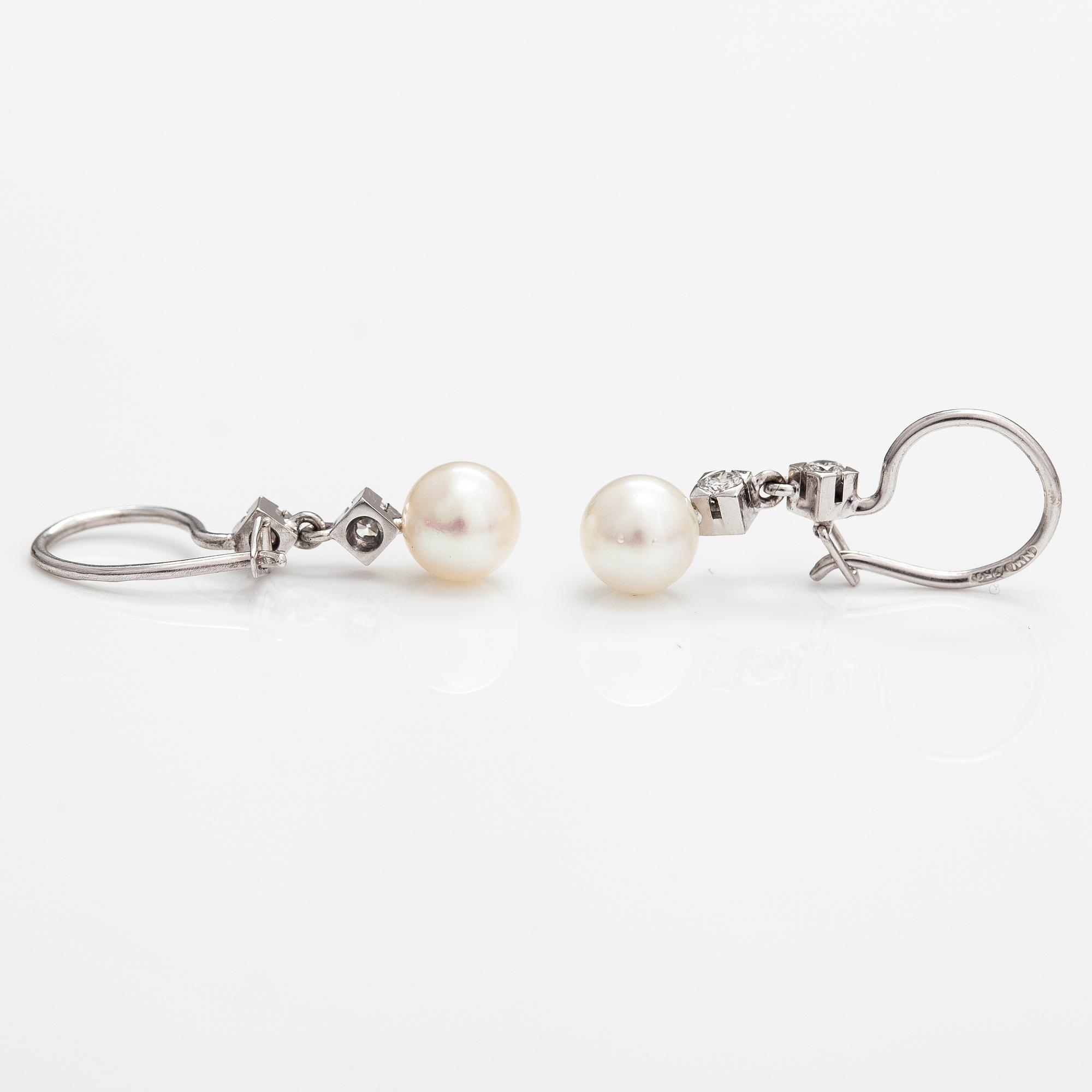 A pair of 18K white gold earrings with cutured pearls and diamonds ca. 0.24 ct in total. Westerback, Helsinki.