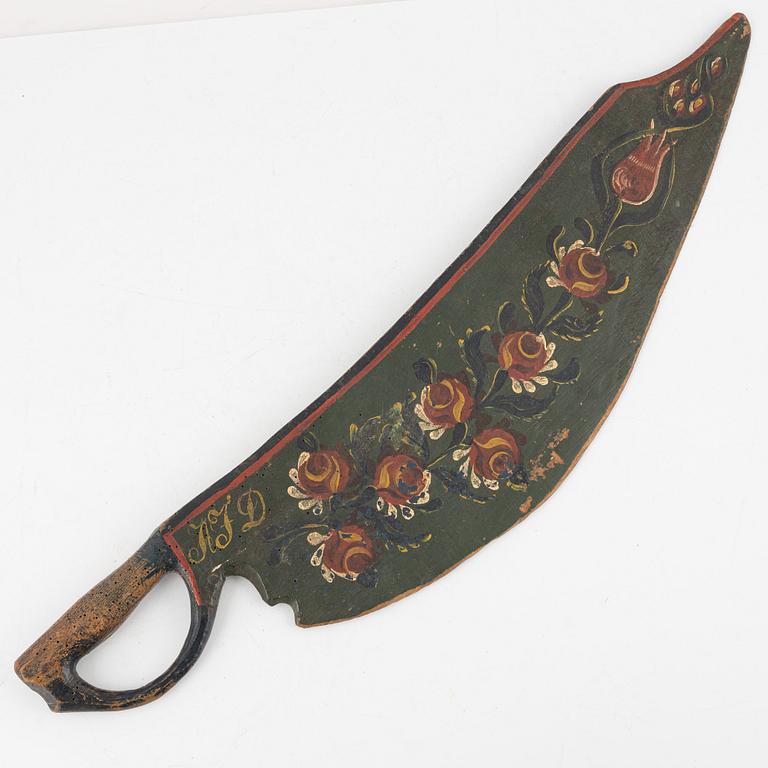 Two Swedish painted wooden knives, first half of the 19th Century.