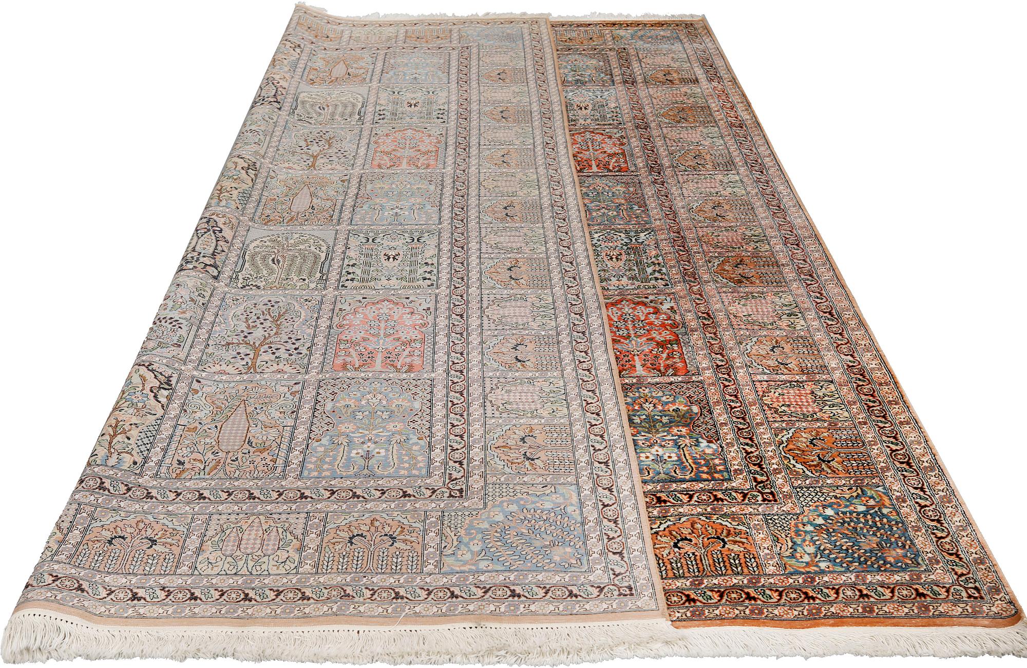 A silk Kashmir carpet, approx. 327 x 243 cm.
