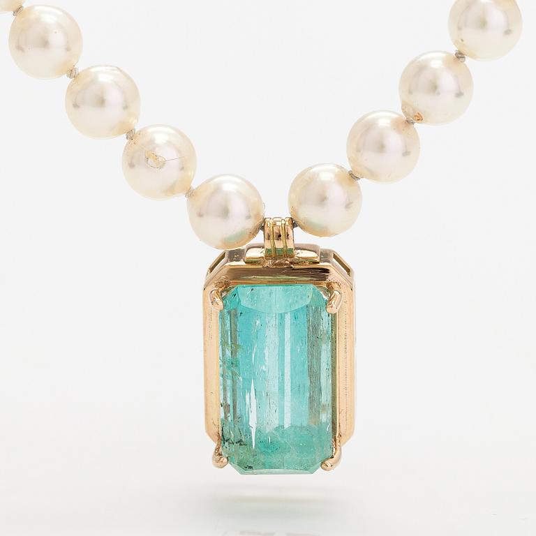 A pearl collier with and aquamarine, 14K and 18K gold and cultured pearls.