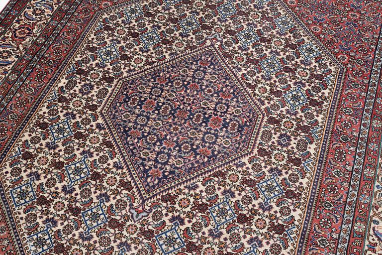 An oriental rug, approx. 238 x 174 cm.