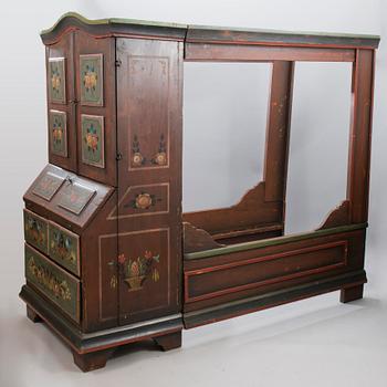 A painted 19th Century folk art bed cabinet.