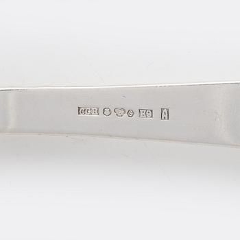 Nine pieces of silver cutlery.