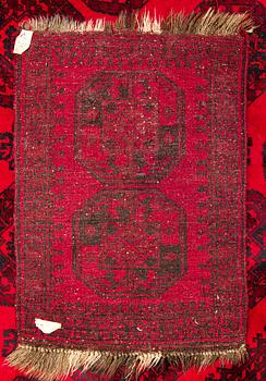 Two Afghan carpets. Ca. 326 x 217 and 88 x 63 cm.