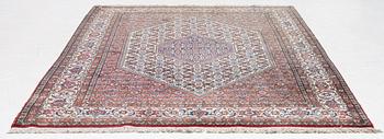 An oriental rug, approx. 238 x 174 cm.