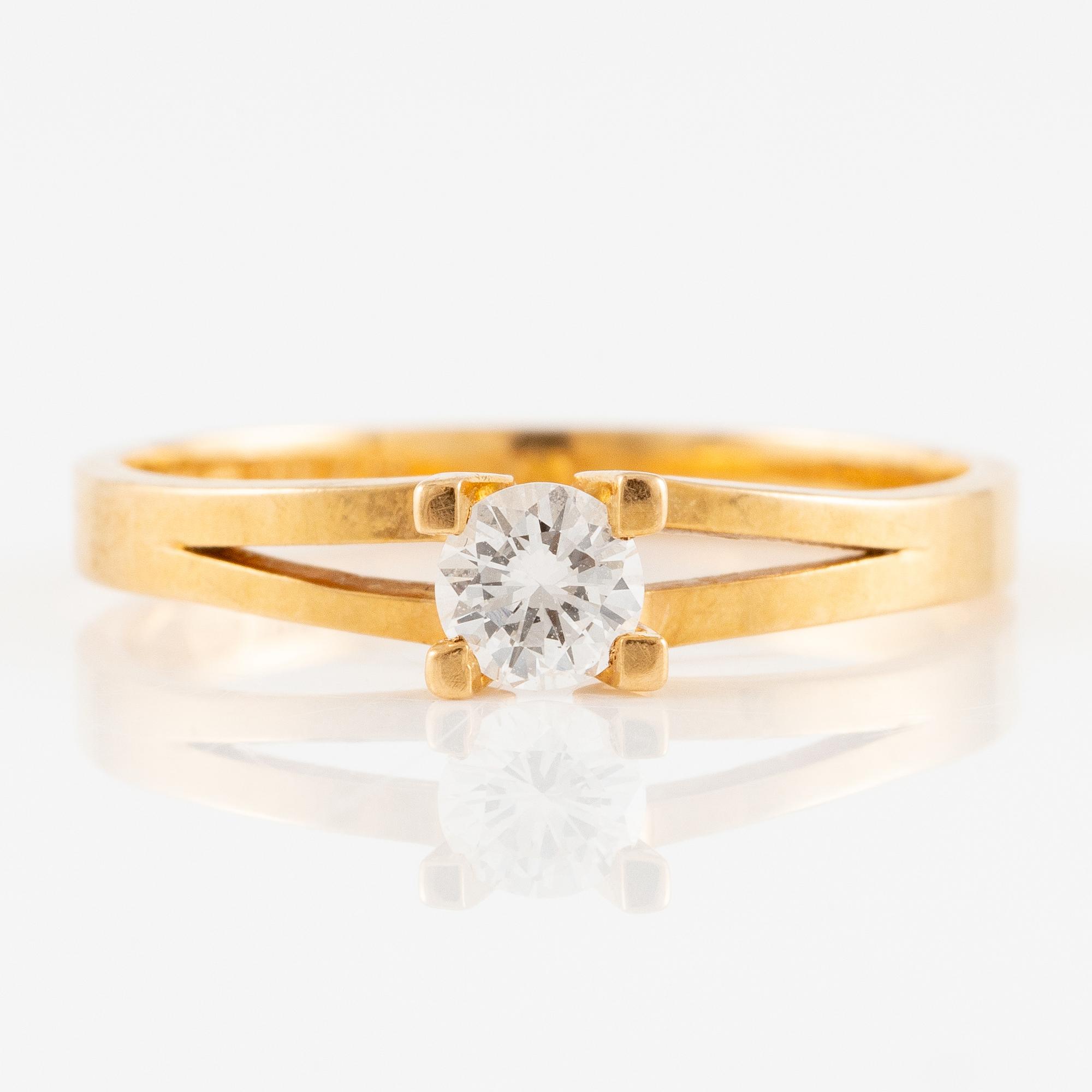 Ring, 18K guld med briljantslipad diamant.