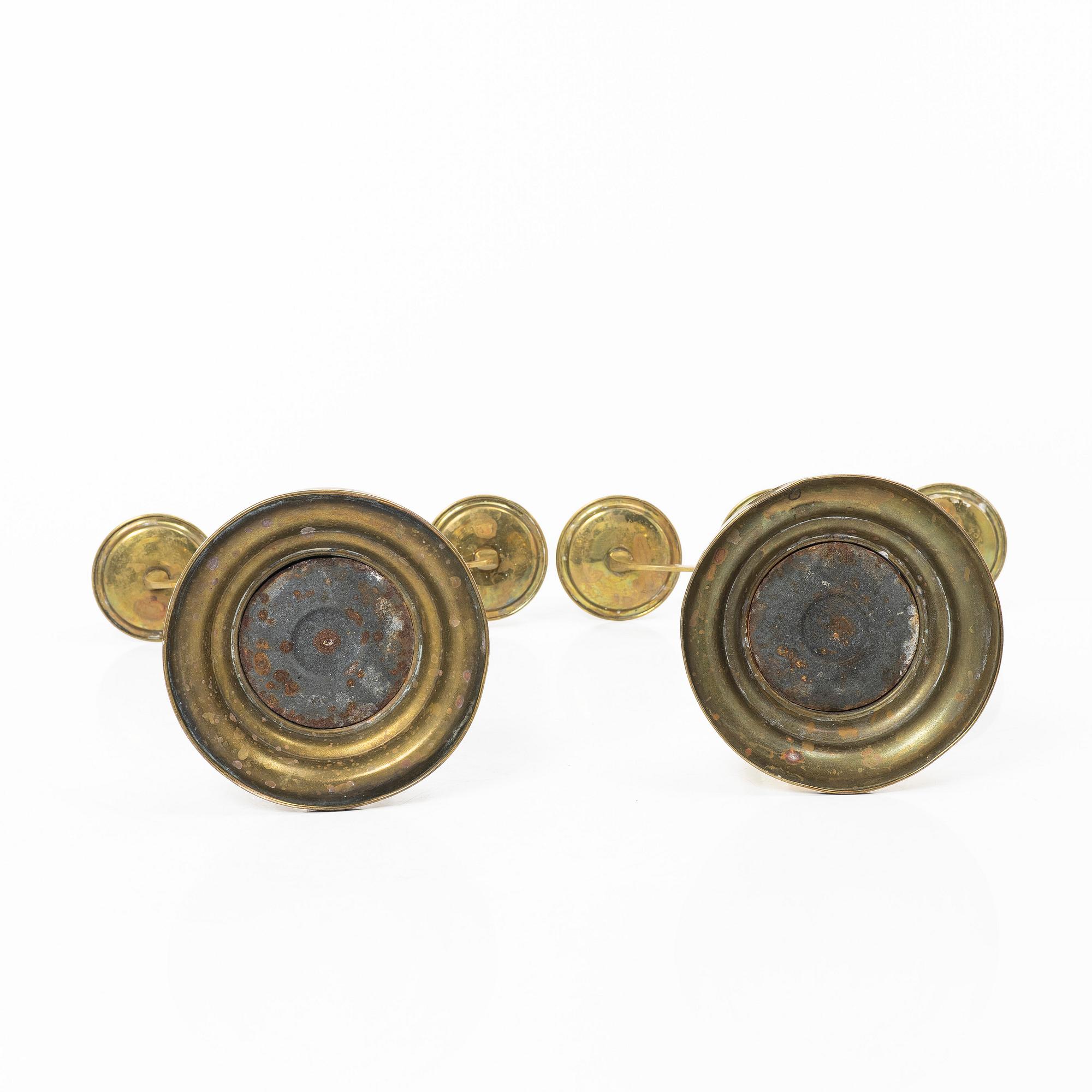 Jugend/Art Nouveau, A pair of brass candelabra, early 20th century.