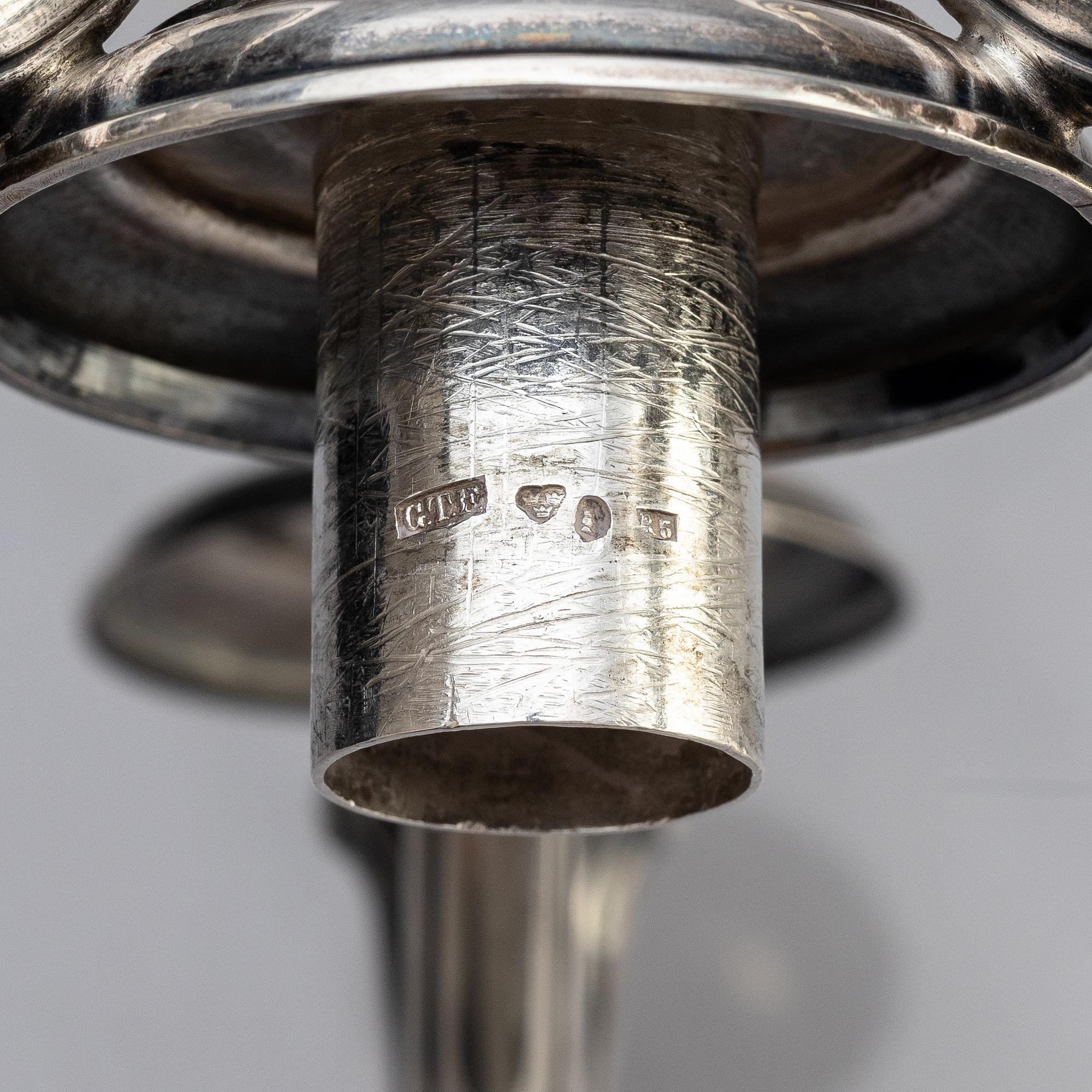A pair of Swedish 19th century silver candelabra, marks of Gustaf Theodor Folcker, Stockholm 1871.