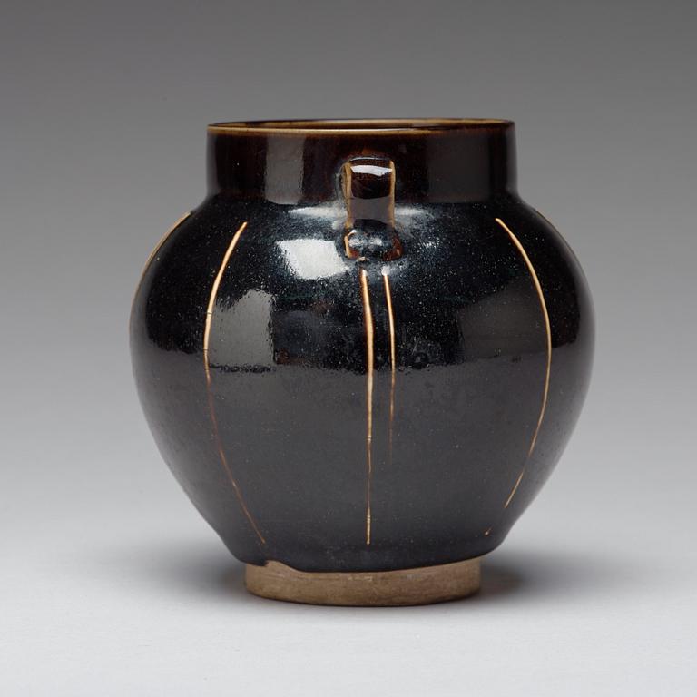 A Henan black glazed ribbed jar, Song dynasty (960-1279).