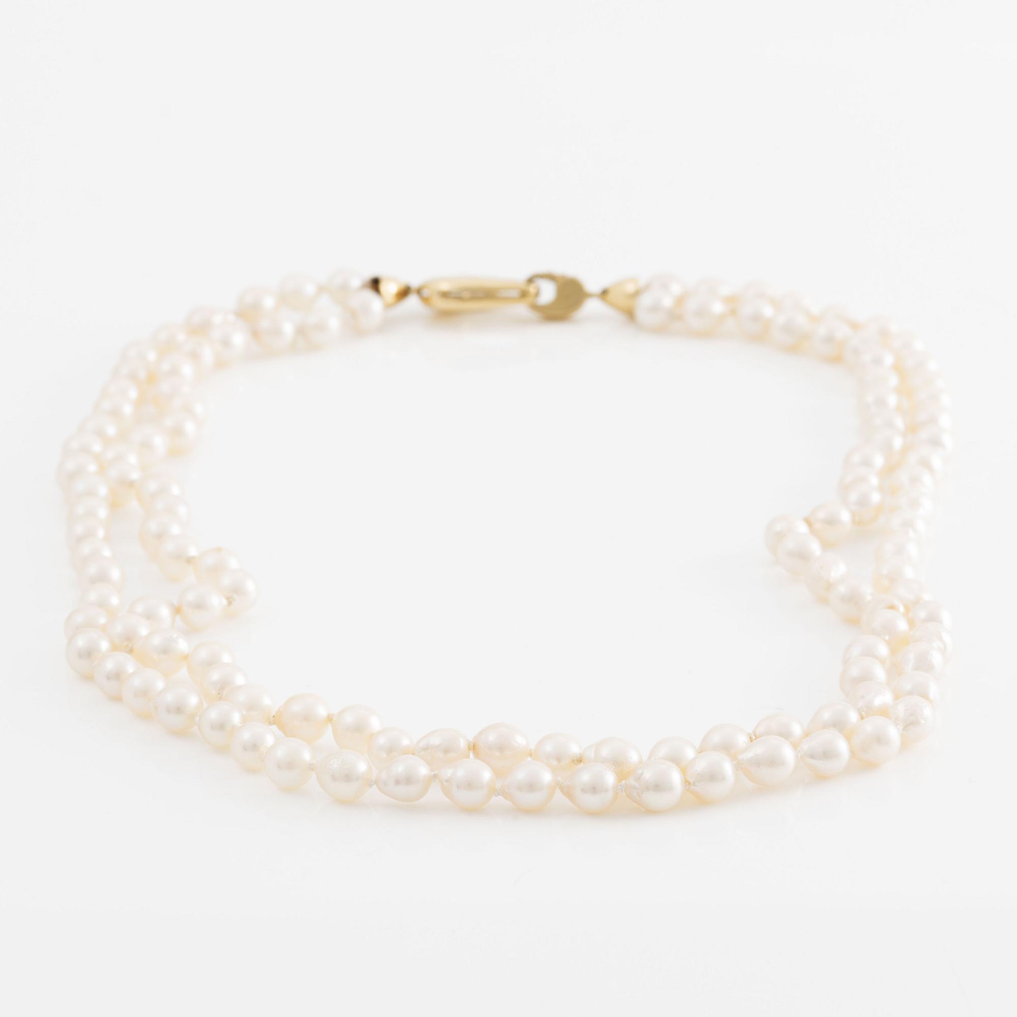 Necklace two rows of cultured pearls clasp 18K gold.