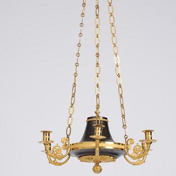 A Swedish Empire ormolu and patinated six-branch chandelier, Stockholm, early 19th century.