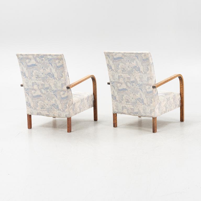 A pair of 1930's armchairs.