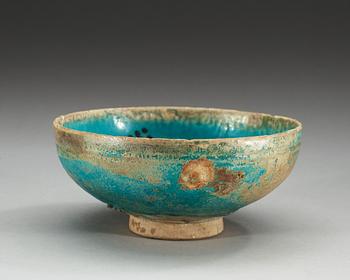 BOWL, pottery. Turquoise glaze with black decoration. Persia 13th century, probably Kashan.