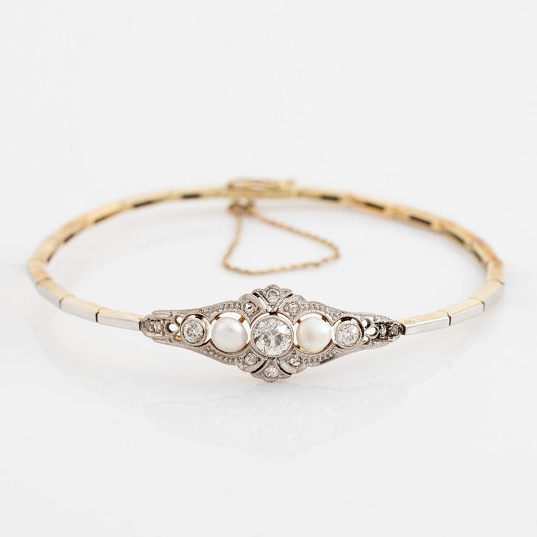 A 14K gold and platinum bracelet set with old- and rose-cut diamonds and pearls.