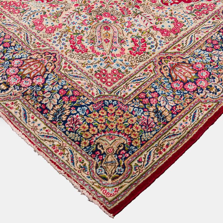 A carpet, Kirman, ca. 333 x 244 cm.