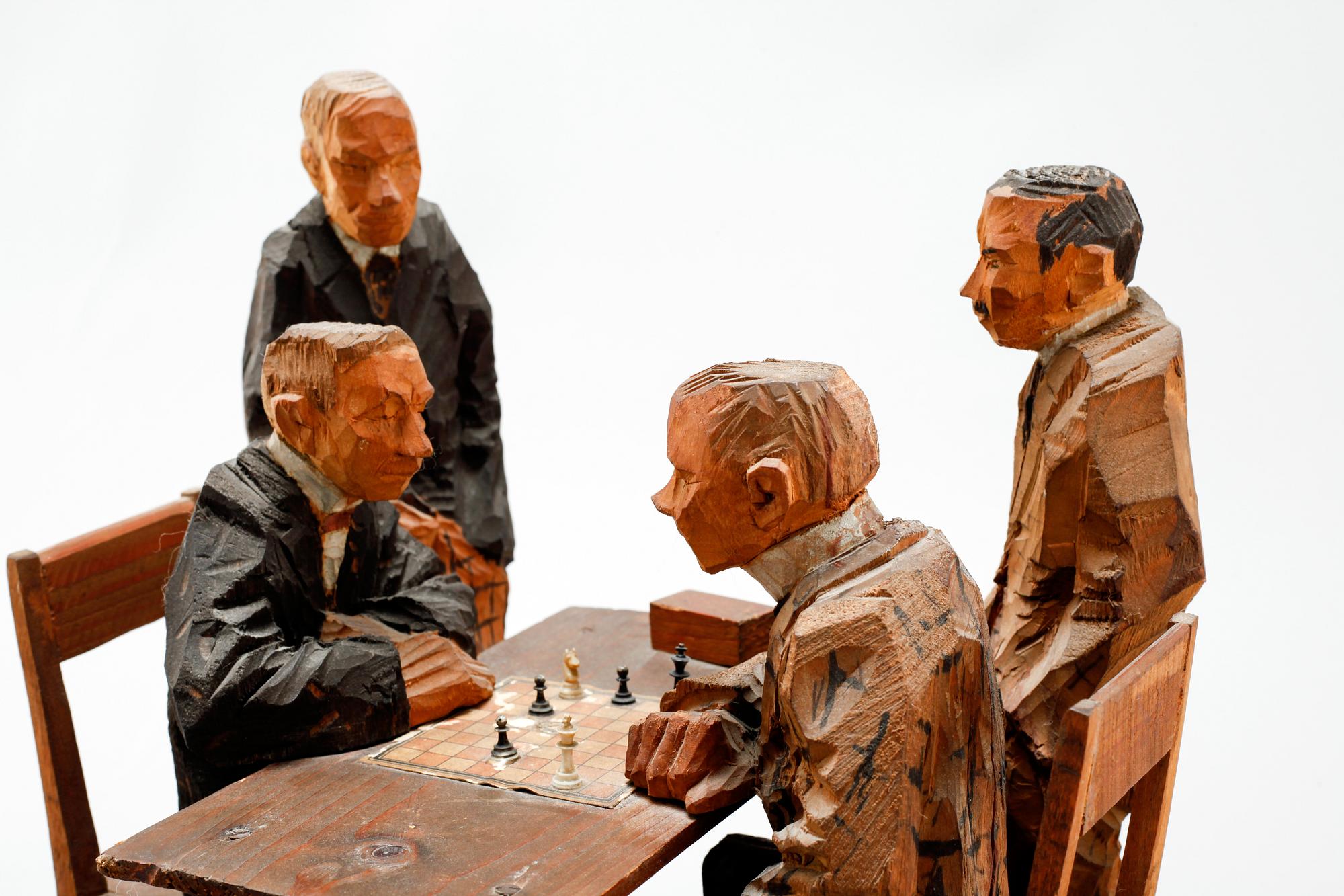 AXEL PETERSSON DÖDERHULTARN, sculpture group, partially painted carved wood, Chess players, stamp signed.
