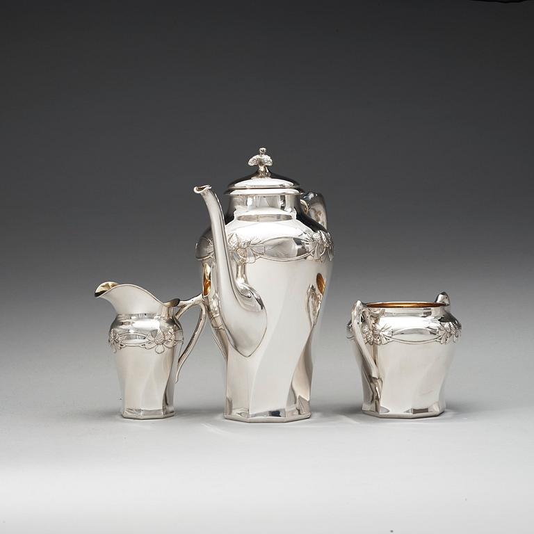 A C.G. Hallberg three pieces Art Nouveau silver coffee service, Stockholm 1904-1905.