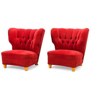 A pair of mid-20th century armchairs.