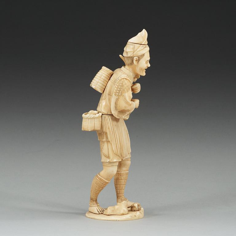 A Japanese ivory figure of a man, Meiji (1868-1912).