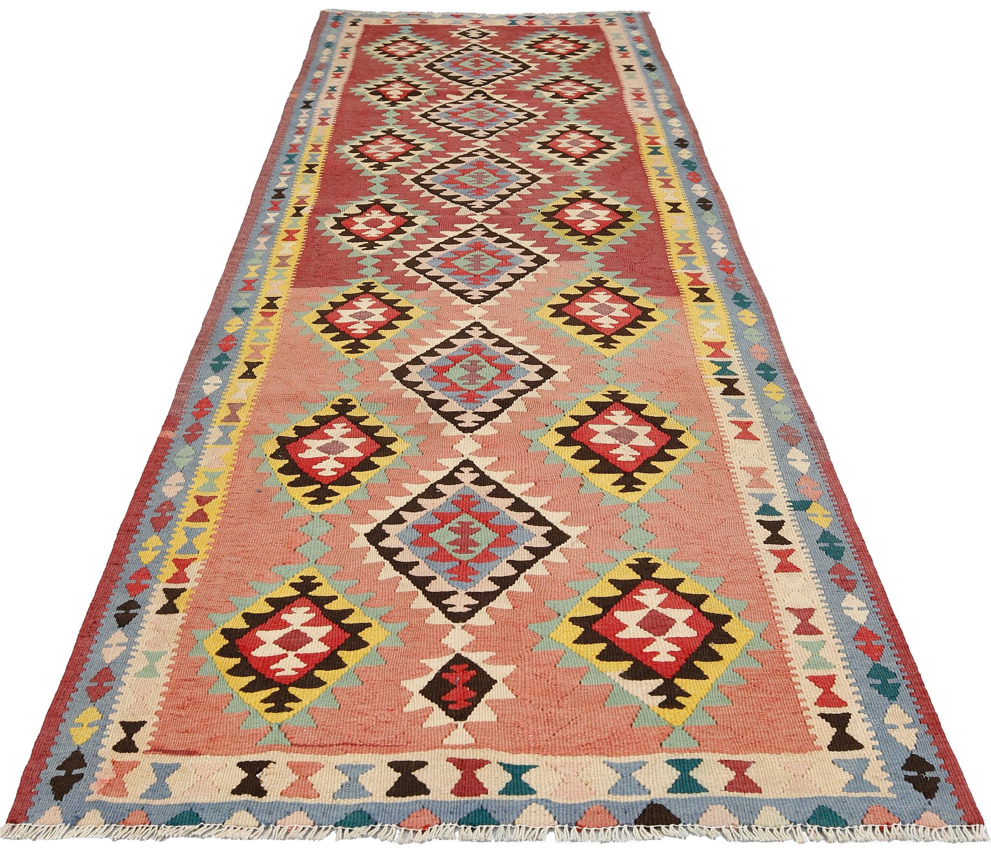 A kurdish kilim carpet, Western Iran, c 323 x 113 cm.
