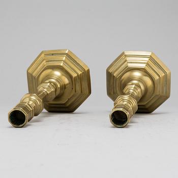 A pair of 18th-Century brass candlesticks, probably from France.