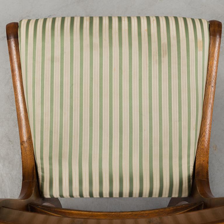 A late 20th century English style dining table and six chairs.