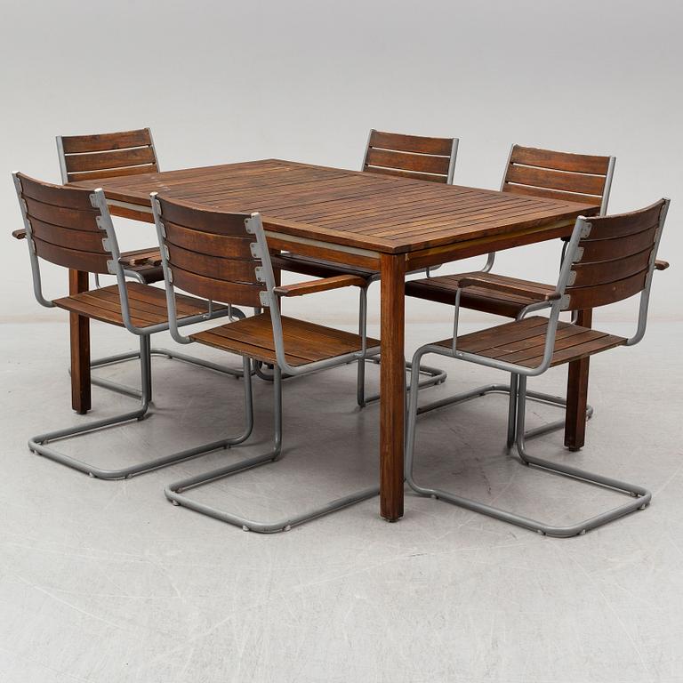 a garden table with 6 chairs, 2000's.