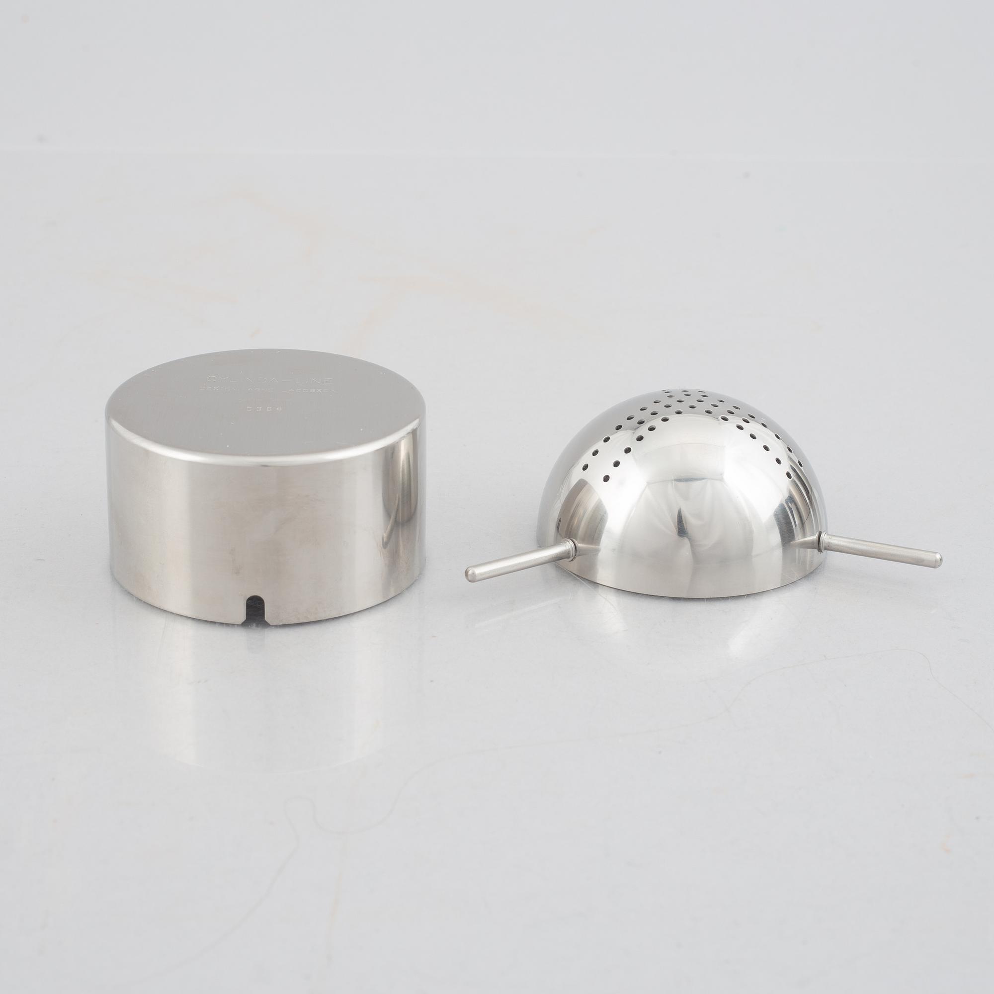 Arne Jacobsen, a 100-year jubilee "Cylinda" stainless steel tea set and a book, Stelton, Denmark, 2002.