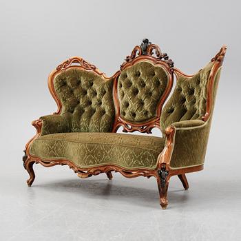 A rococo style sofa, four chairs and a table, second half of the 19th Century.