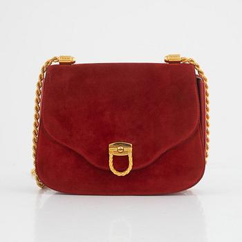 Gucci, a vintage suede bag.
