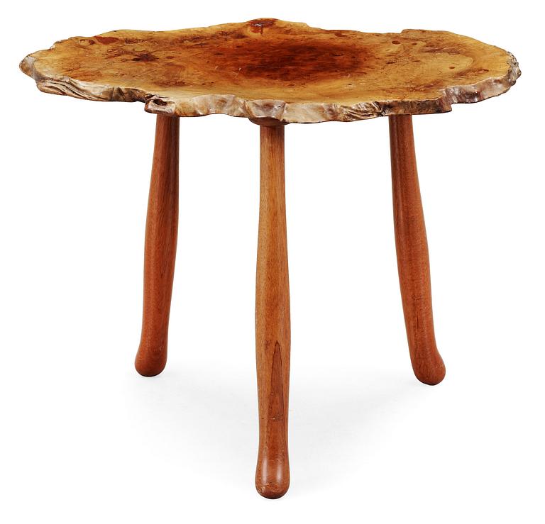 A Josef Frank elmroot and mahogany table by Svenskt Tenn.