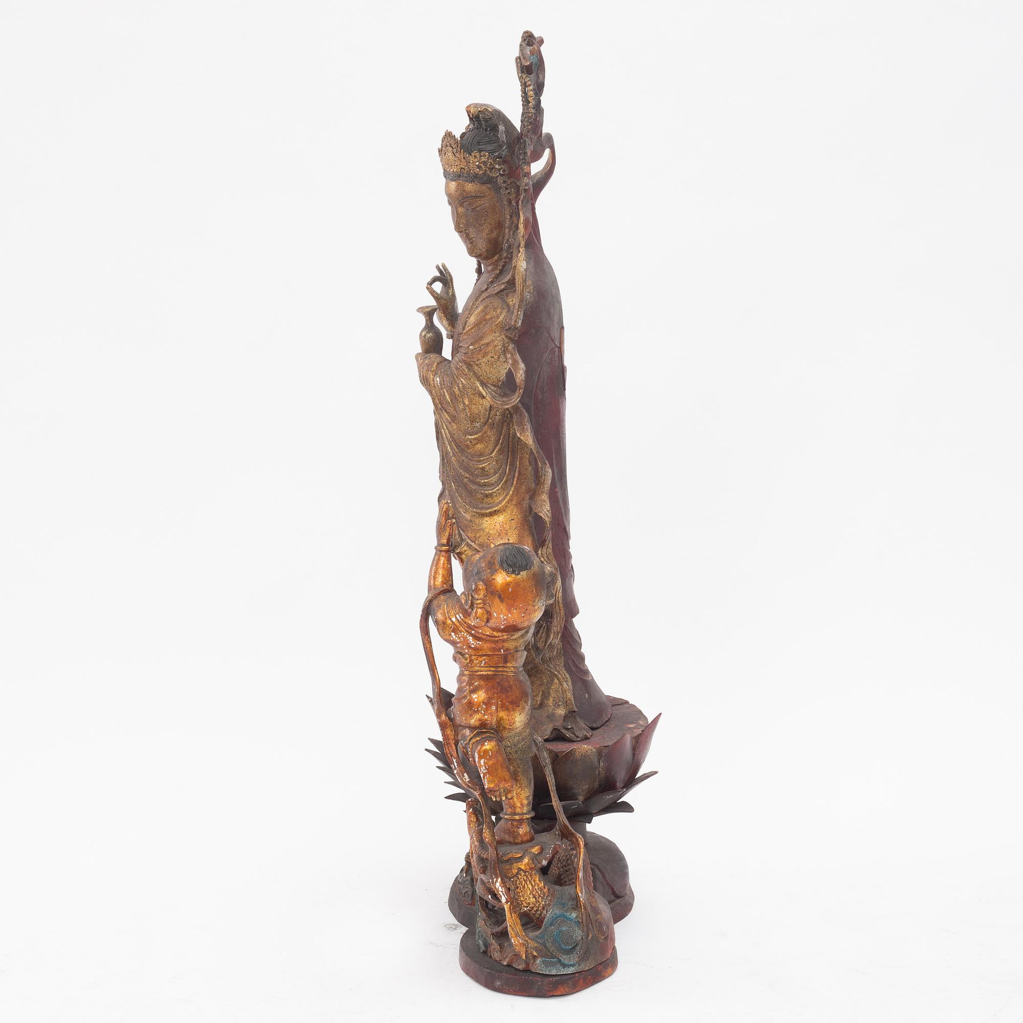 A large gilt and lacquer sculpture group, three parts, 20th century.